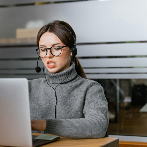 Support specialist working at a laptop to manage merchant operations